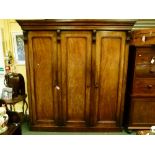 Impressive Victorian mahogany triple wardrobe, the interior fitted two short over two long drawers