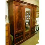 Early 20th Century mahogany satinwood crossbanded and string inlaid triple wardrobe having central