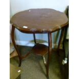 Early 20th Century mahogany shaped circular top occasional table, raised on four cabriole supports