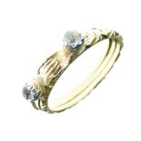 Victorian gimmel ring, set with a paste either side of the clasping hands, opening to reveal the two