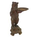 19th Century Black Forest carved hallstand in the form of a standing bear having glass eyes and