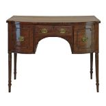 Regency mahogany bowfront kneehole sideboard fitted a central drawer flanked by a deep drawer and