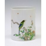 Chinese Famille Verte brush pot decorated with a bird and butterfly amongst foliage, 22.75cm high