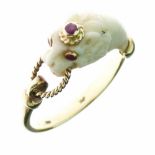 Ivory and ruby ring, circa 1900, carved as a lions head with ruby eyes and ruby crown, to his