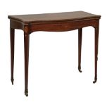George III Channel Islands inlaid mahogany serpentine front fold over card table, standing on