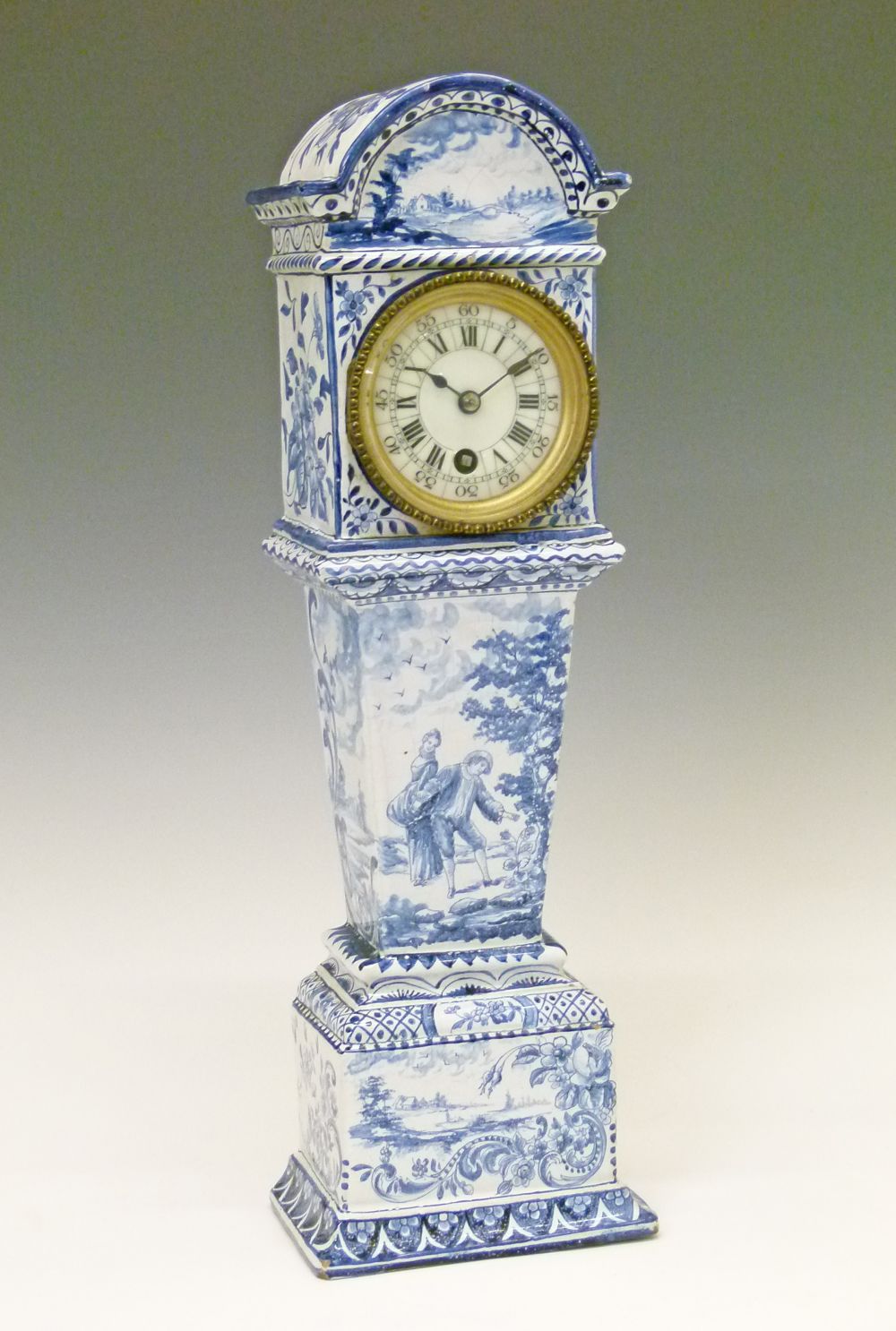 Late 19th Century Continental faience cased timepiece in the form of a longcase clock, having