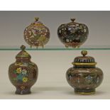 Four small Japanese cloisonnÚ jars with covers, each with typical foliate decoration, two having a