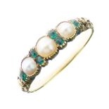 Victorian three stone pearl ring, with emerald points between and to the shoulders of the carved