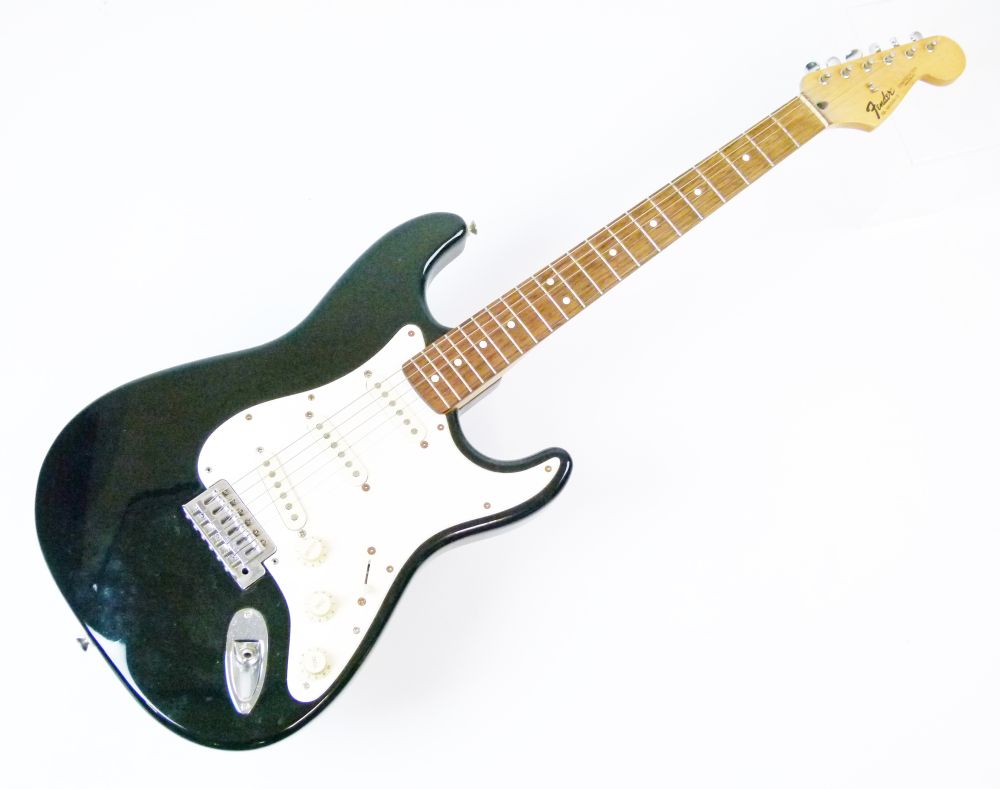 Guitars - Fender Stratocaster, serial number MN588519, black body with off-white and cream fittings,