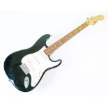 Guitars - Fender Stratocaster, serial number MN588519, black body with off-white and cream fittings,