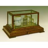 Early 20th Century oak cased barograph by Chadburn's of Liverpool having bevelled glazed panels, one