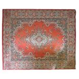 Modern Middle Eastern rug decorated with a central medallion on a red ground within multi borders,