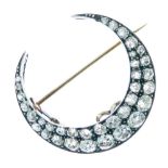 Late Victorian diamond crescent brooch, the double row of thirty-five rose, single and brilliant cut