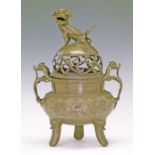 Chinese bronze koro, the pierced domed cover having a Kylin finial, dragon side handles and standing