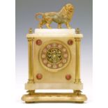 19th Century French alabaster cased mantel clock surmounted with a gilt spelter figure of a lion,