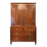 Regency mahogany linen press in the manner of Gillows, the upper section with moulded cornice,