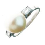 Pearl and diamond ring, the 10mm pearl between baguette set shoulders, the white mount stamped '