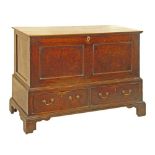 George III oak mule chest, the hinged cover opening to reveal a fitted interior with candle box