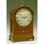 George III string inlaid mahogany cased bracket clock, the arch top case having a brass carrying