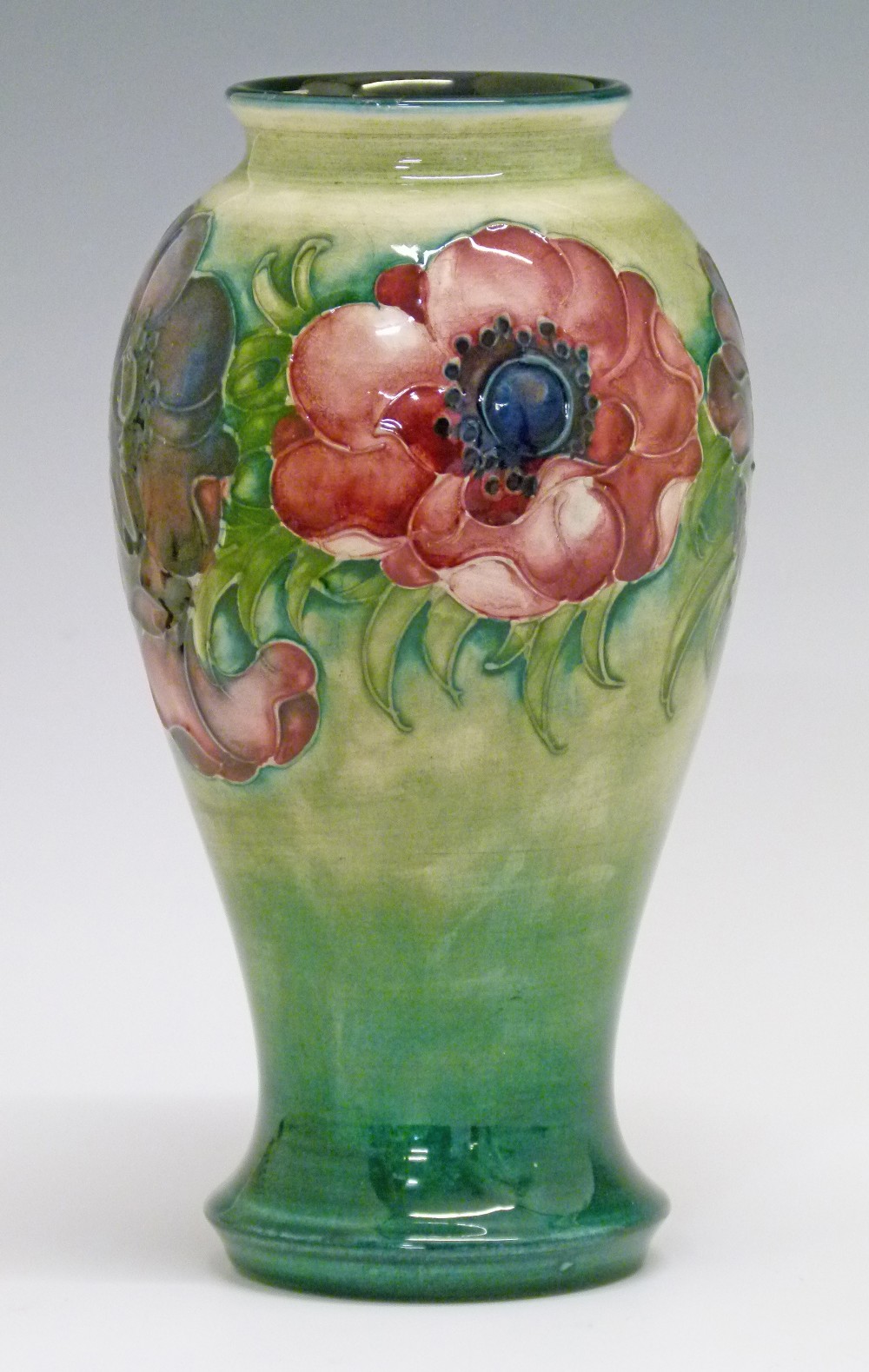 Moorcroft 'Anemone' vase of baluster form having typical stylised foliate decoration on a two tone