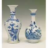 Two Chinese porcelain vases, each having painted blue and white foliate decoration in the Kangxi