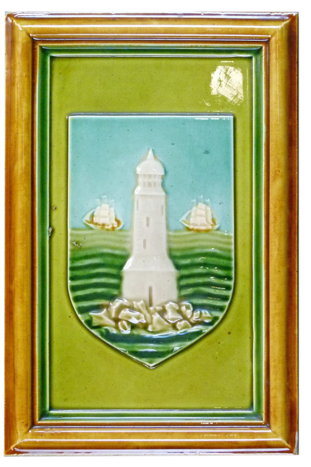 19th Century rectangular pottery tile plaque decorated with a shield showing a lighthouse with two