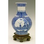 Chinese porcelain baluster shaped vase having two circular reserve panels, the first depicting a