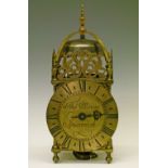 17th Century style brass lantern clock, the pierced frets with stylised foliate decoration, dial