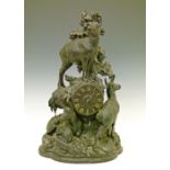 Late 19th Century Black Forest mantel clock, the carved case decorated with mountain goats, dial