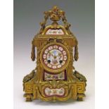 19th Century French ormolu and porcelain mantel clock, the case with urn finial, cast foliate swags,