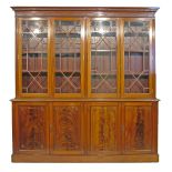 Early 20th Century Chippendale style mahogany library bookcase, the upper section having dentil
