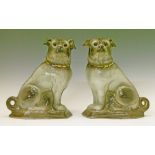Pair of Staffordshire grey glazed pottery figures of Pugs, each having glass eyes and with a gilt