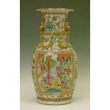 Chinese Famille Rose baluster shaped vase having two rectangular reserve panels typically
