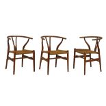 Modern Design - Hans Wegner - Three teak framed Wishbone elbow chairs, each having a rush seat and