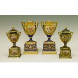 Two pairs of Vienna style urn shaped two handled vases, each having painted decoration and