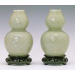 Pair of Chinese celadon glazed porcelain double gourd shaped vases, each having engraved foliate