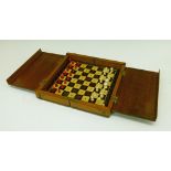 Late 19th/early 20th Century turned bone travelling chess set in a folding mahogany case/board, case