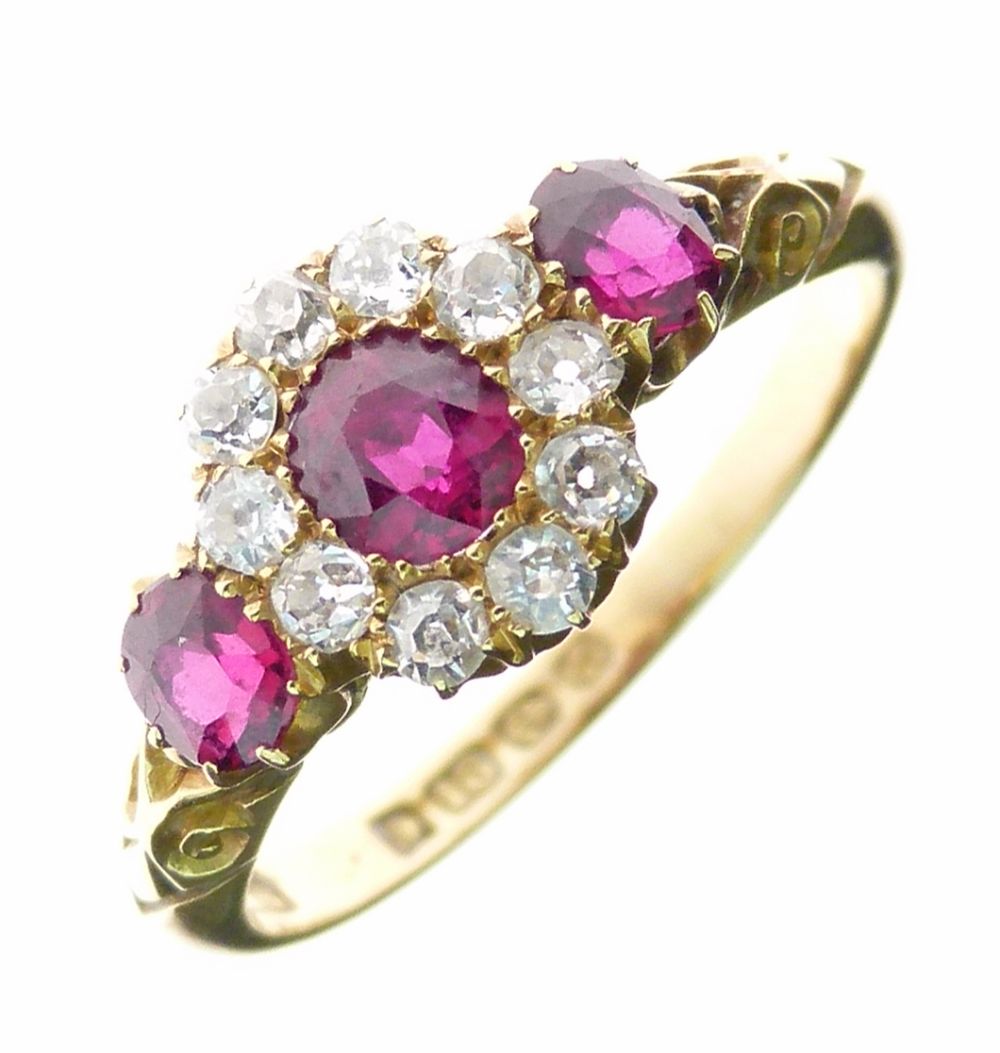 Edwardian ruby and diamond 18ct gold ring, Birmingham 1905, the central oval cut stone, 4.3mm x 4mm,