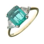 Emerald and diamond three stone 18ct gold ring, the step cut measuring approximately 8.8mm x 7.1mm x