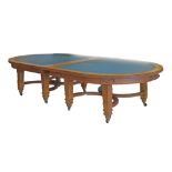 Early 20th Century oak oval top library/boardroom table, constructed in four sections and having