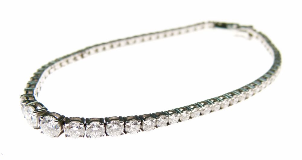 Diamond line bracelet, the sixty-six diamonds, graduated to the centre totalling approximately 4.8