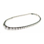 Diamond line bracelet, the sixty-six diamonds, graduated to the centre totalling approximately 4.8