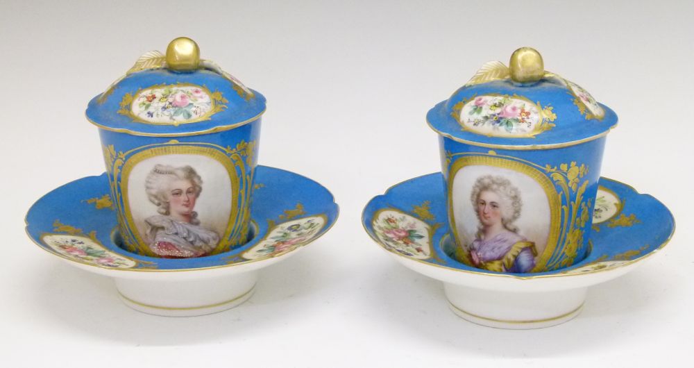 Pair of 19th Century Sevres style trembleuse chocolate cups and saucers, the cups with oval