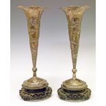 Pair of Chinese export silver trumpet shaped specimen vases, circa 1900, each having embossed dragon