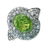 Georgian ring set with a central oval cut peridot, enclosed by diamonds and diamond set shoulders,