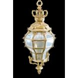 Cast brass hall lantern having a crown pediment, mask head decoration and inset with bevelled