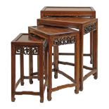 Nest of four Chinese hardwood tea tables, each having a carved and pierced frieze, 31cm - 51cm wide