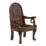 Antique oak elbow chair, the back splat primitively carved with a full-length figure of a lady and