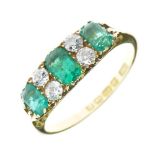 Three stone emerald 18ct gold Edwardian ring, Birmingham 1904, the graduated step cut stone with