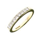 Diamond 18ct gold half hoop ring, the nine channel set Princess cuts totalling approximately 0.54